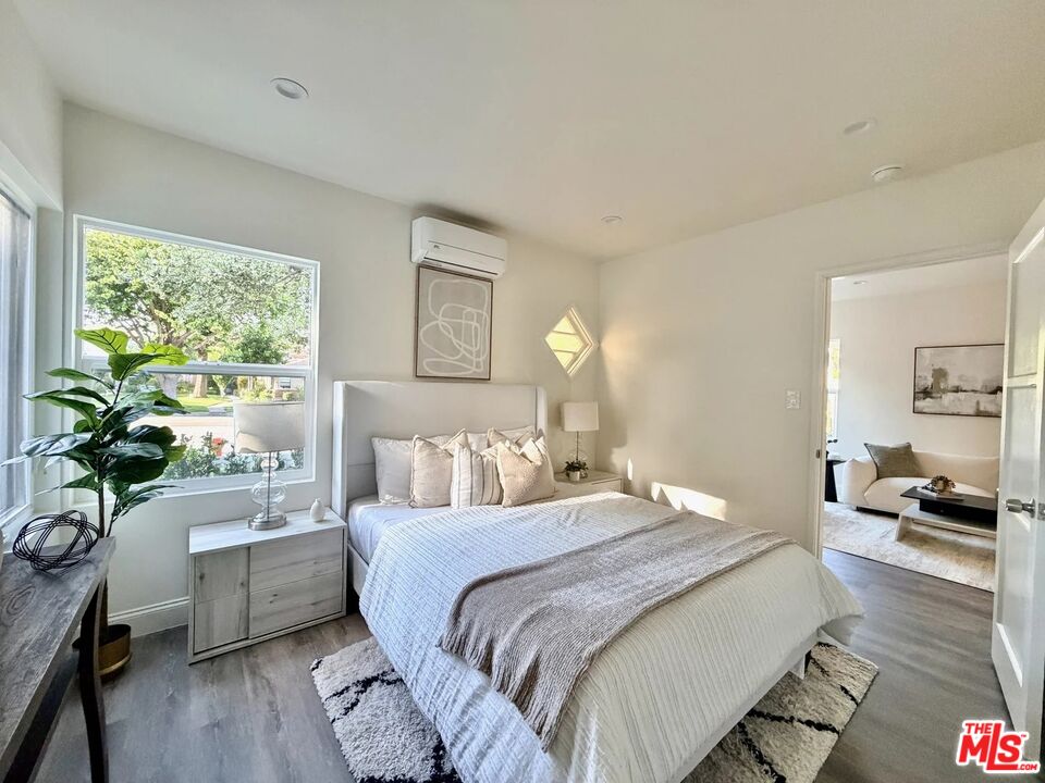 2924 West Riverside Drive Burbank, CA 91505 - Photo 9 of 15 a bedroom with a bed and a couch