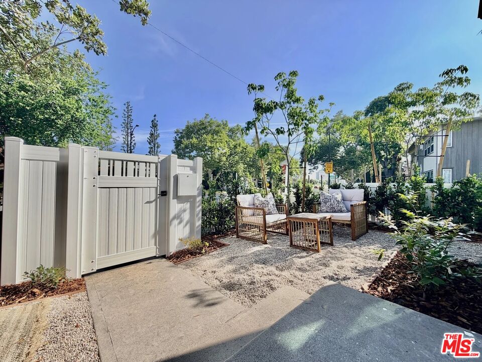 2924 West Riverside Drive Burbank, CA 91505 - Photo 10 of 15 a backyard of a house with table and chairs