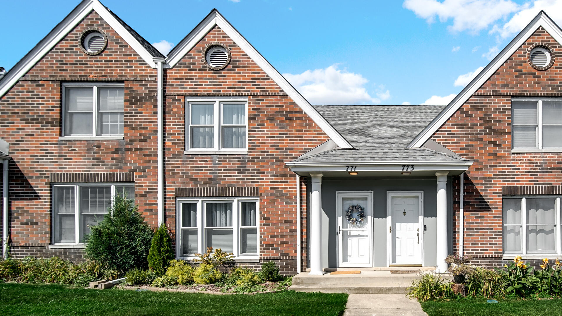 front view of a house with a yard