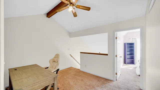 a view of a hallway with workspace