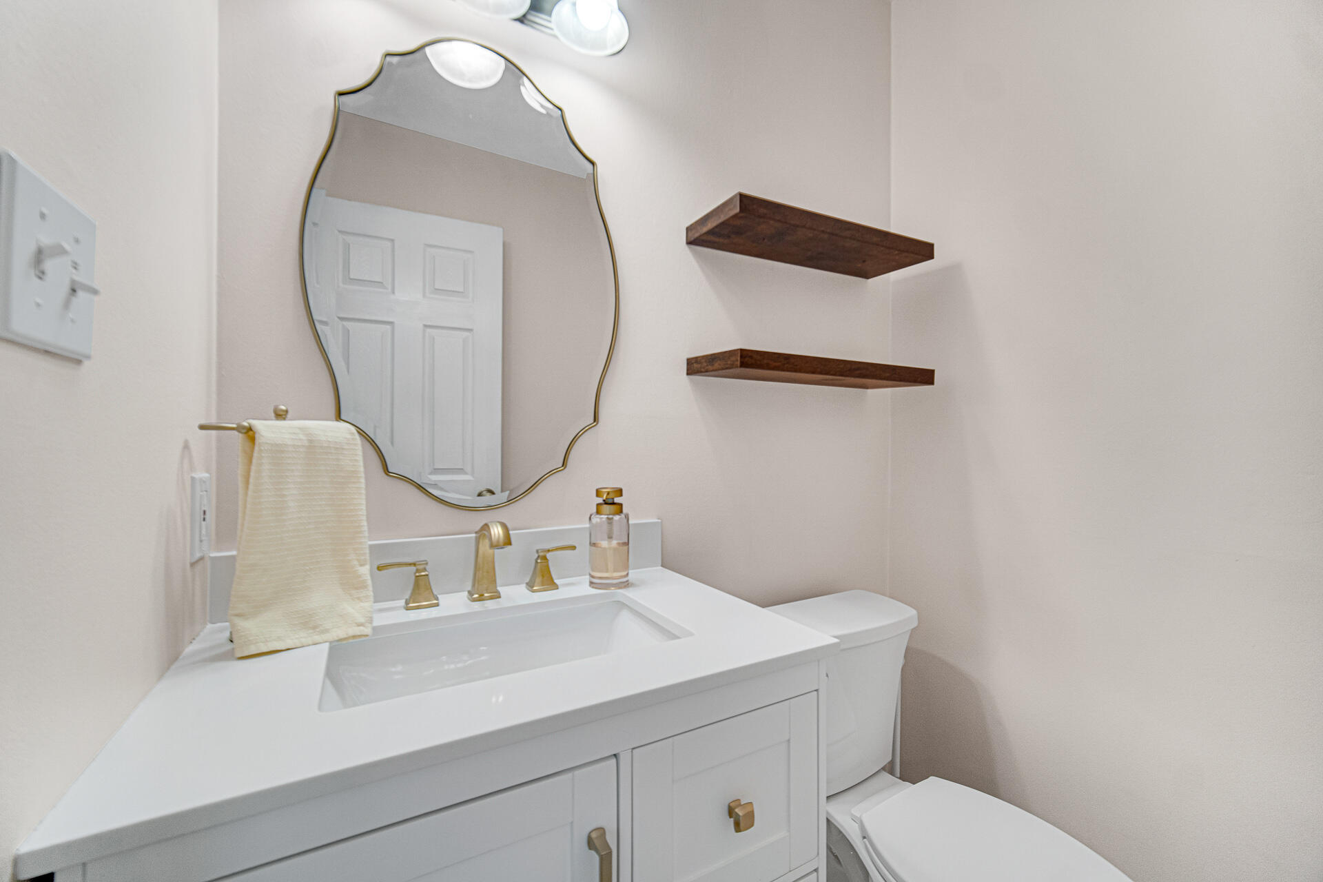771 Kenmare Parkway Crown Point, IN 46307 - Photo 14 of 19 a bathroom with a toilet sink and mirror