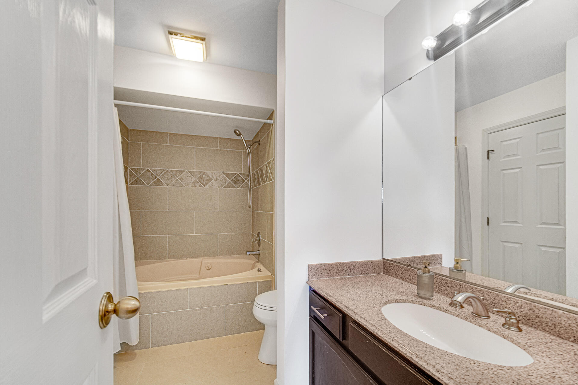 771 Kenmare Parkway Crown Point, IN 46307 - Photo 19 of 19 a bathroom with a granite countertop sink a toilet and shower