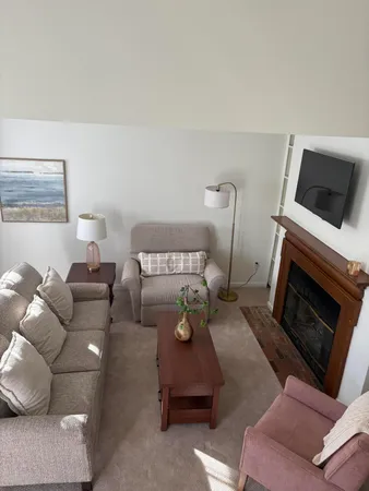 a bedroom with furniture and a fireplace