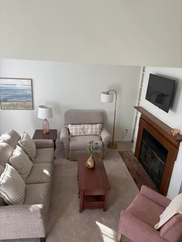 a bedroom with furniture and a fireplace