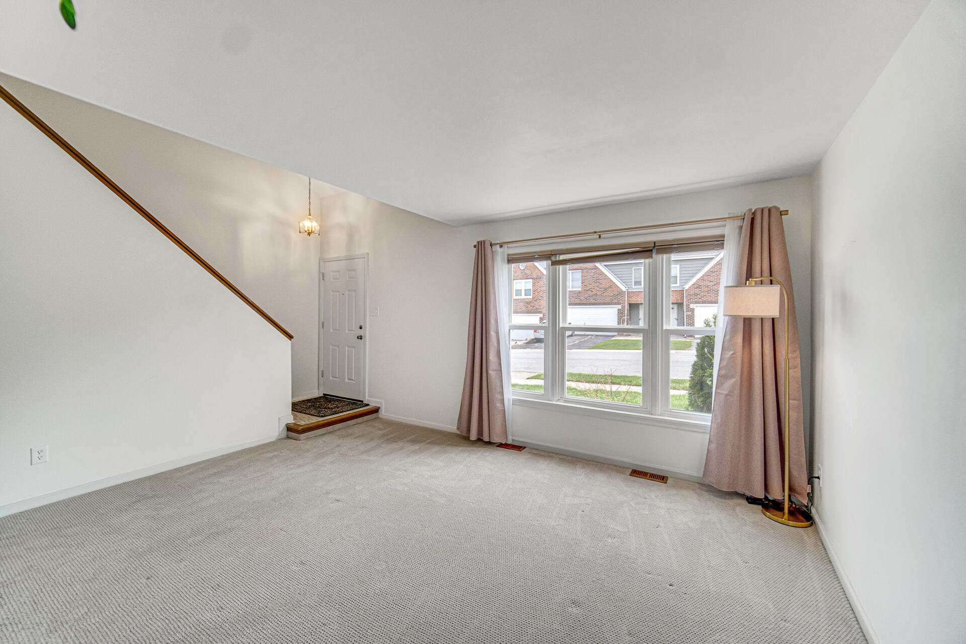 771 Kenmare Parkway Crown Point, IN 46307 - Photo 8 of 19 an empty room with windows