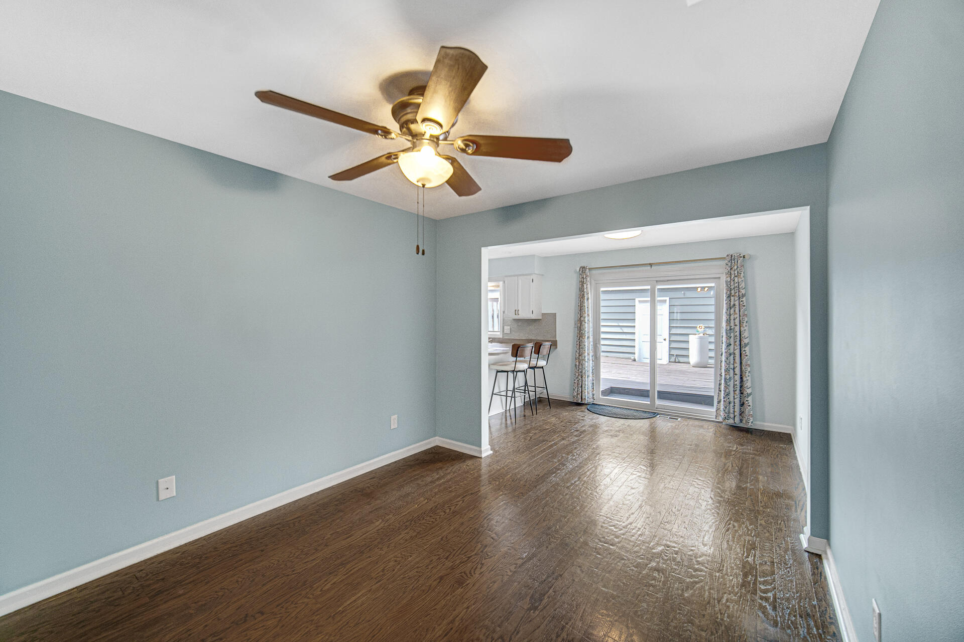 771 Kenmare Parkway Crown Point, IN 46307 - Photo 9 of 19 an empty room with wooden floor fan and windows