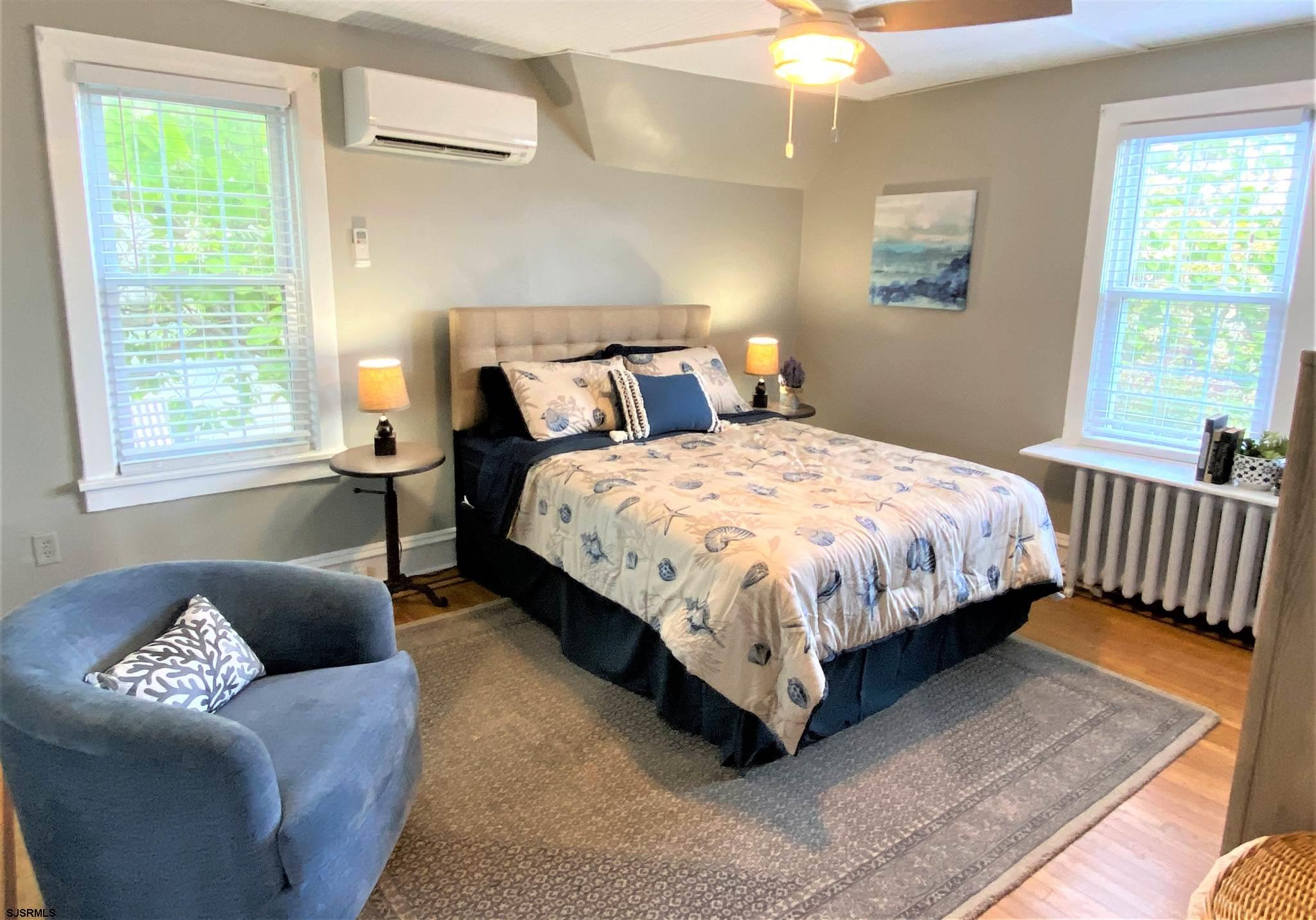 7207 Ventnor Avenue, Unit WINTER RENTAL Ventnor City, NJ 08406 - Photo 15 of 25 a bedroom with bed couch and window