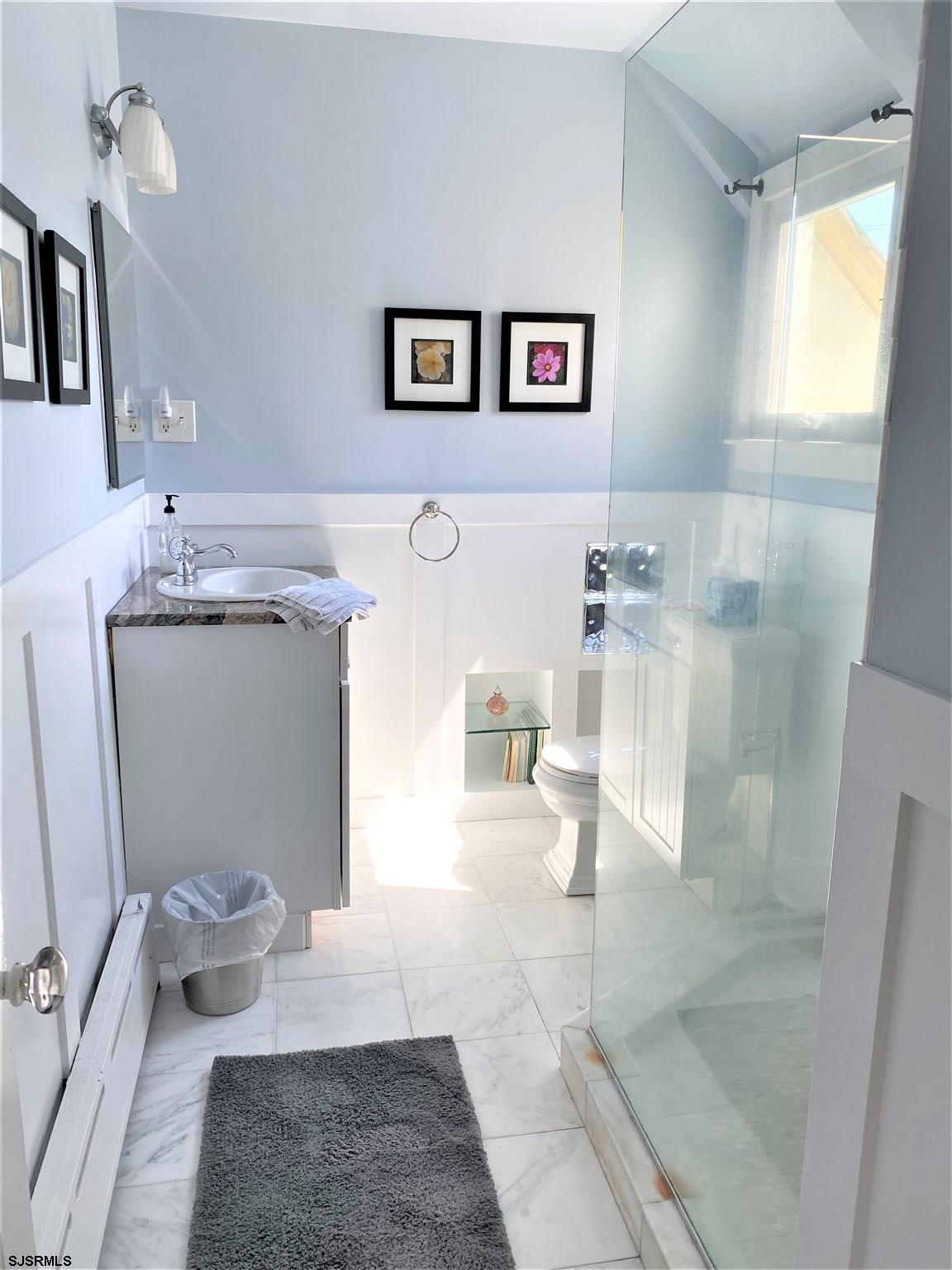 7207 Ventnor Avenue, Unit WINTER RENTAL Ventnor City, NJ 08406 - Photo 16 of 25 a bathroom with a sink toilet and shower