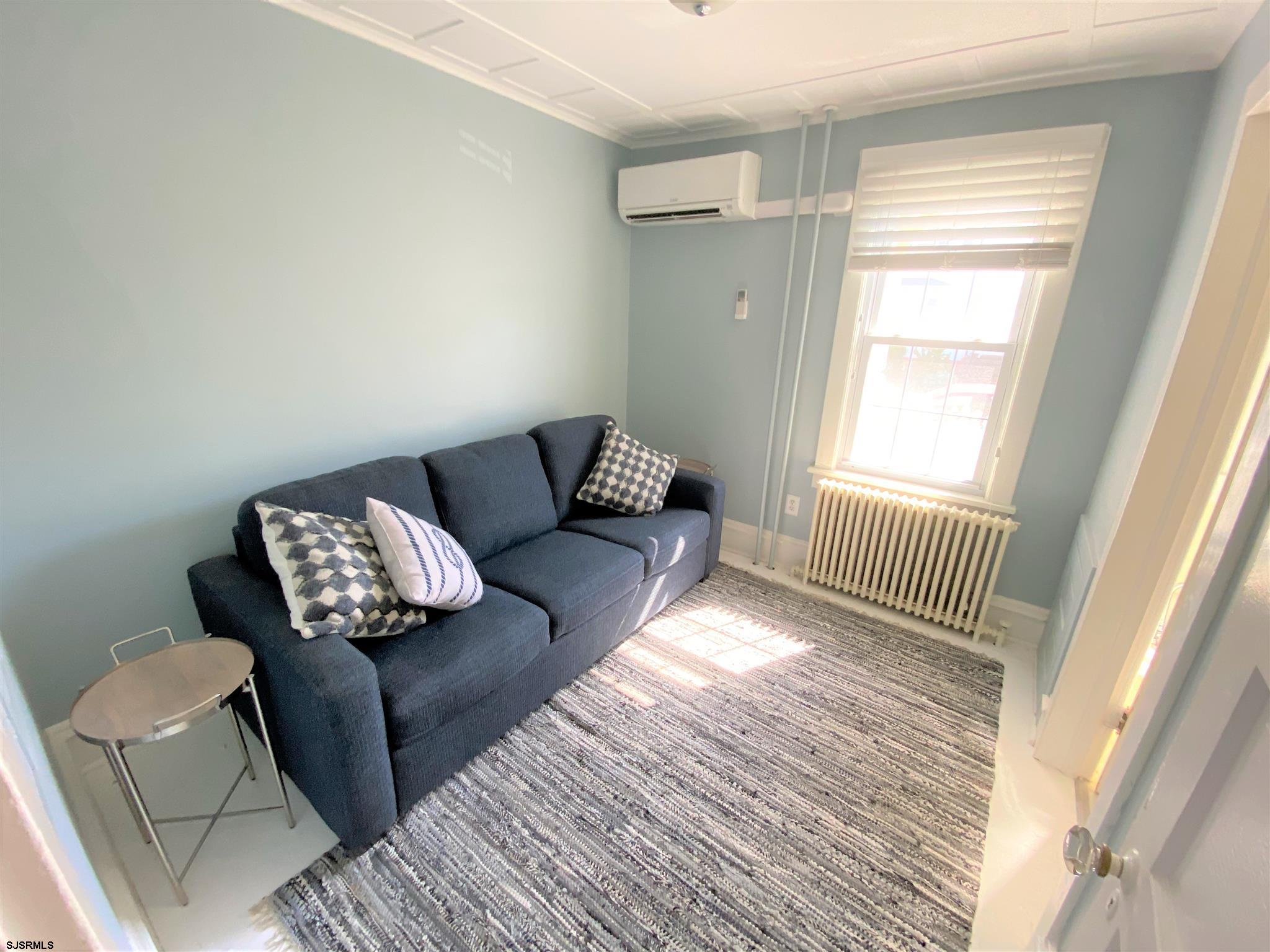 7207 Ventnor Avenue, Unit WINTER RENTAL Ventnor City, NJ 08406 - Photo 20 of 25 a living room with furniture and a window