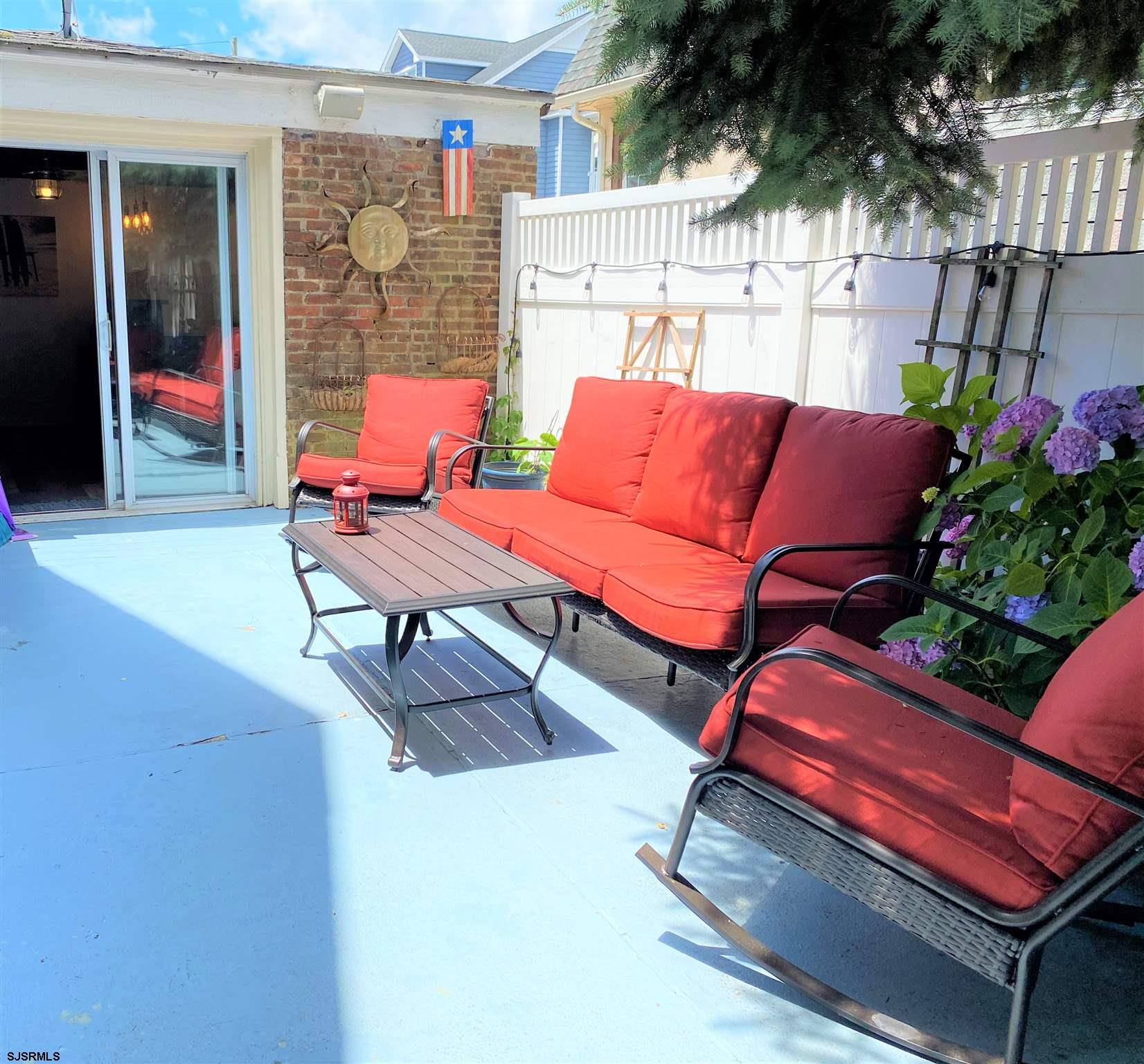 7207 Ventnor Avenue, Unit WINTER RENTAL Ventnor City, NJ 08406 - Photo 22 of 25 a outdoor space with a couch and potted plants