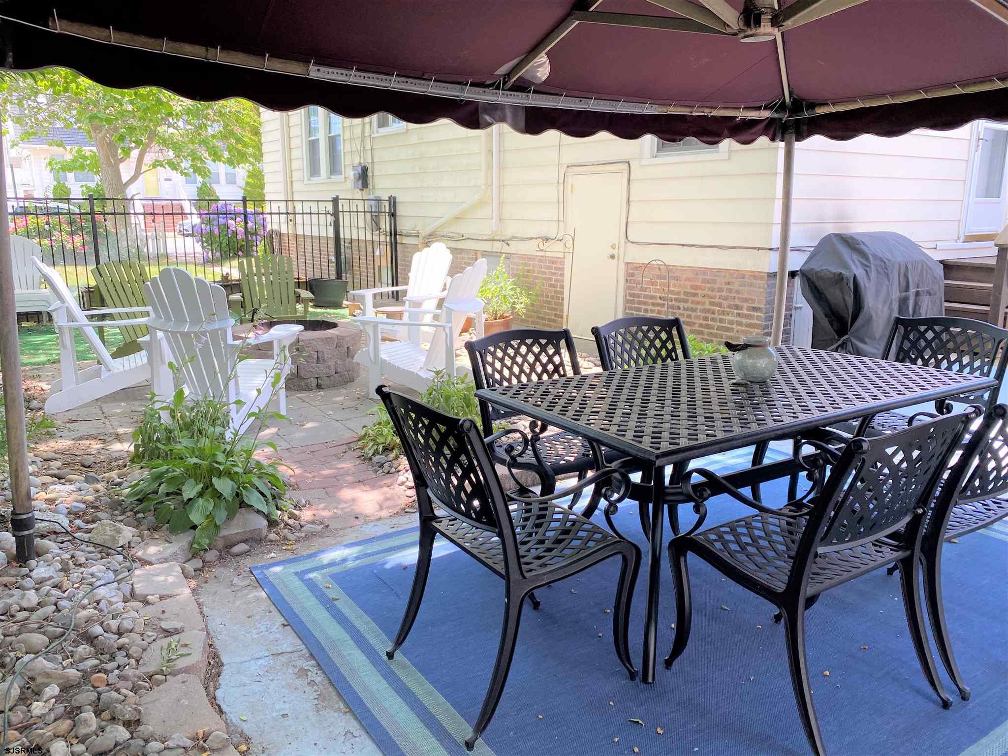 7207 Ventnor Avenue, Unit WINTER RENTAL Ventnor City, NJ 08406 - Photo 24 of 25 a view of an outside dining area with furniture