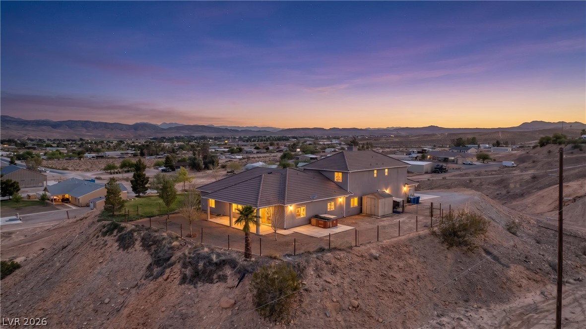 575 Gann Avenue Logandale, NV 89021 - Photo 2 of 75 Perched on a desert hillside, this home offers tranquil evenings and sweeping mountain vistas.