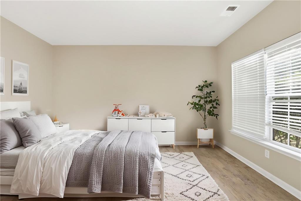 4968 Locherby Drive Fairburn, GA 30213 - Photo 5 of 39 a bedroom with a bed and a window