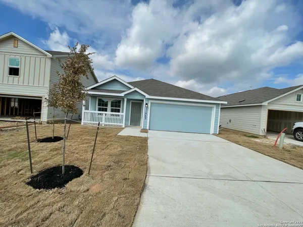 a front view of a house with parking space
