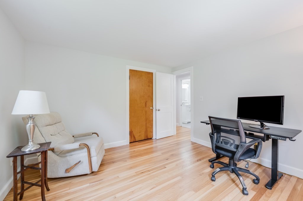 21 Cutler Drive Ashland, MA 01721 - Photo 15 of 28 a view of a workspace with furniture and wooden floor