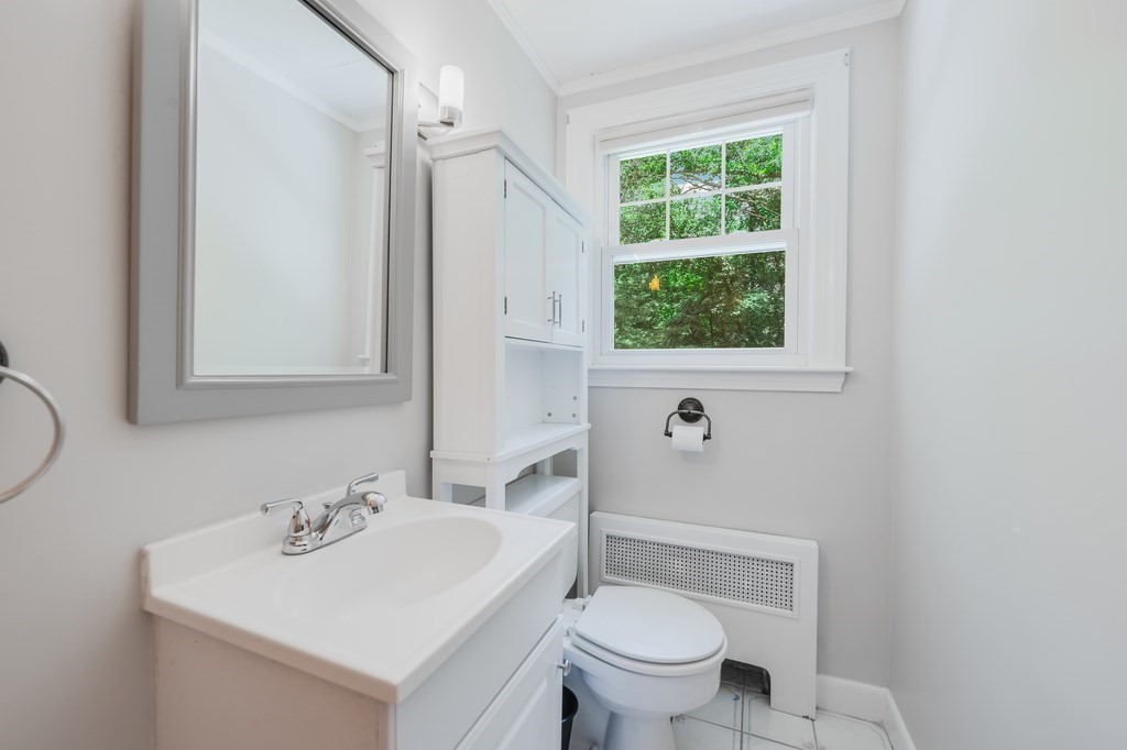 21 Cutler Drive Ashland, MA 01721 - Photo 19 of 28 a bathroom with a sink toilet and a mirror