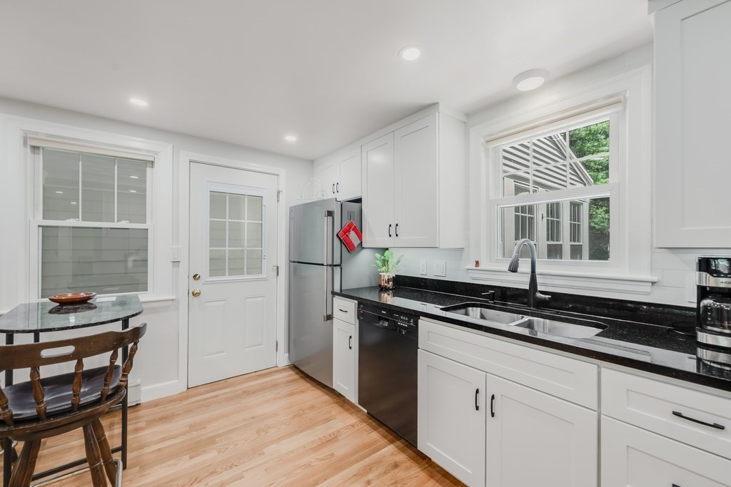 21 Cutler Drive Ashland, MA 01721 - Photo 5 of 28 a kitchen that has a sink and a stove in it
