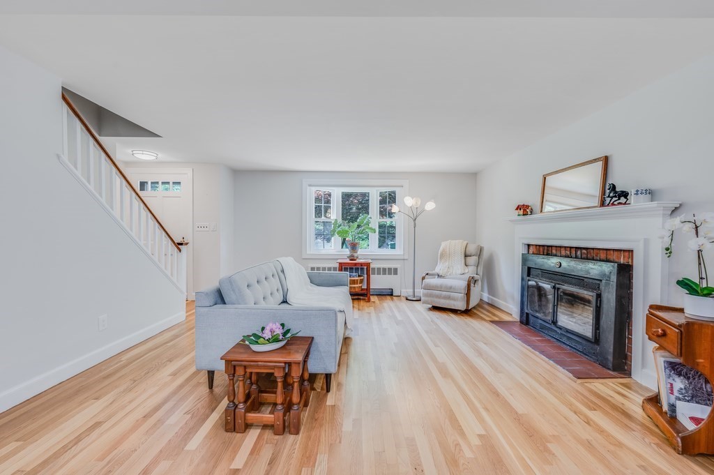 21 Cutler Drive Ashland, MA 01721 - Photo 9 of 28 a living room with furniture and a fireplace