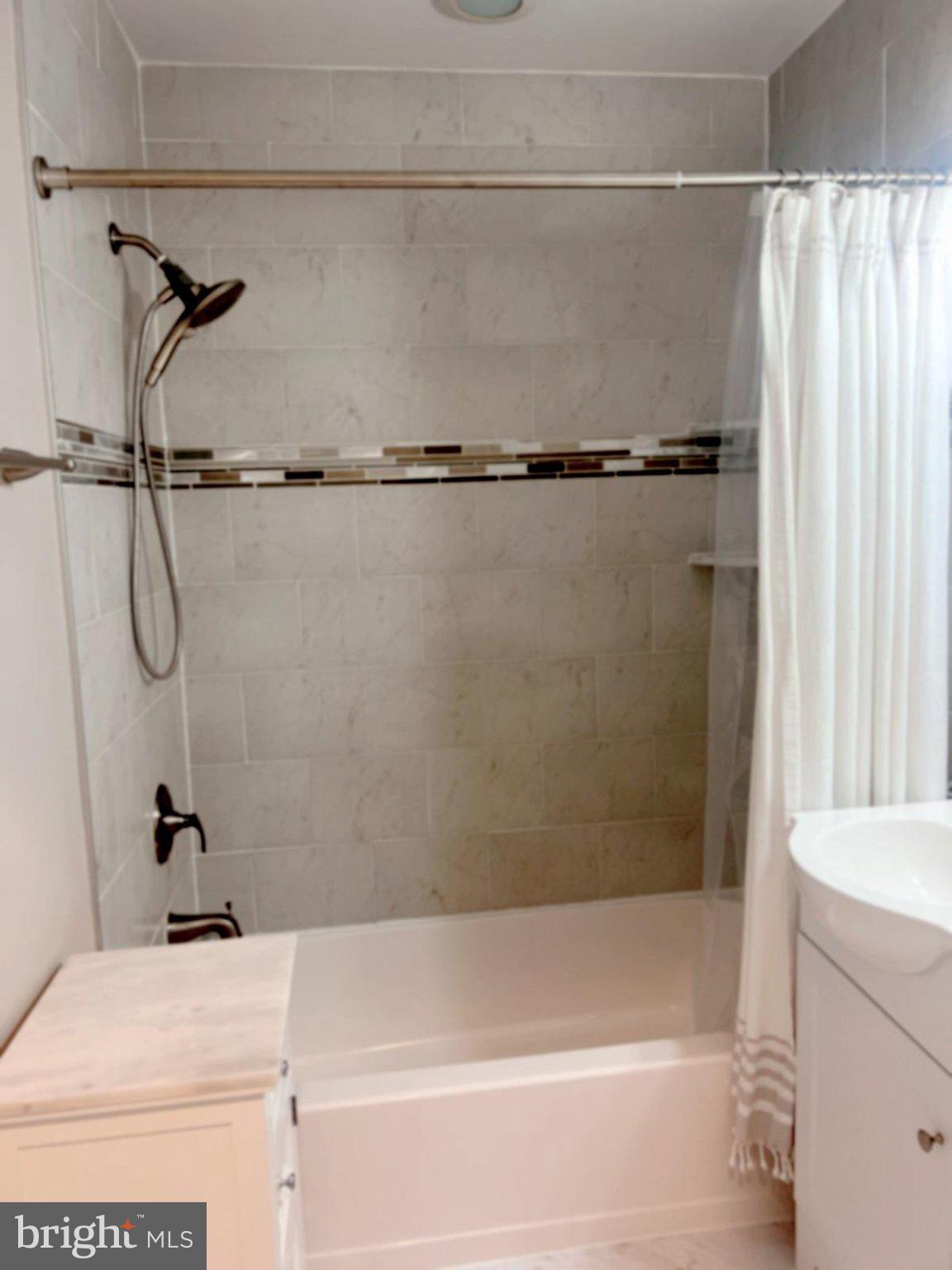 2006 Griffith Road Falls Church, VA 22043 - Photo 13 of 17 a bathroom with a shower and a bath tub