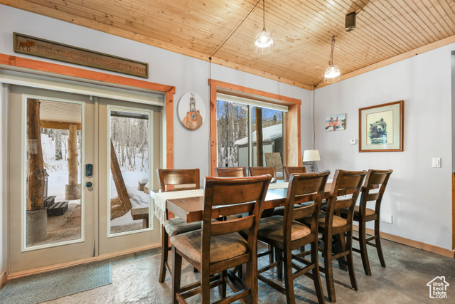 2029 West Tollgate Road Coalville, UT 84017 - Photo 15 of 43 Dining space featuring french doors, wood ceiling, and concrete flooring