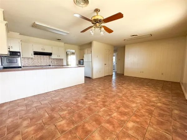 a view of a kitchen with a sink and cabinets