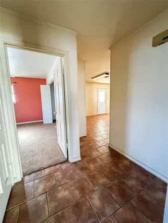 a view of a walk in closet with wooden floor