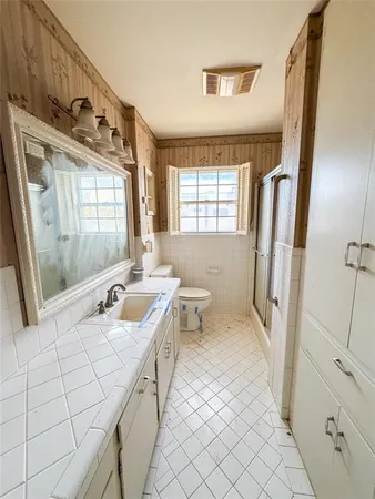 a bathroom with a double vanity sink mirror and double