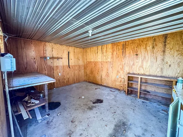 a view of a yard with a house in the background