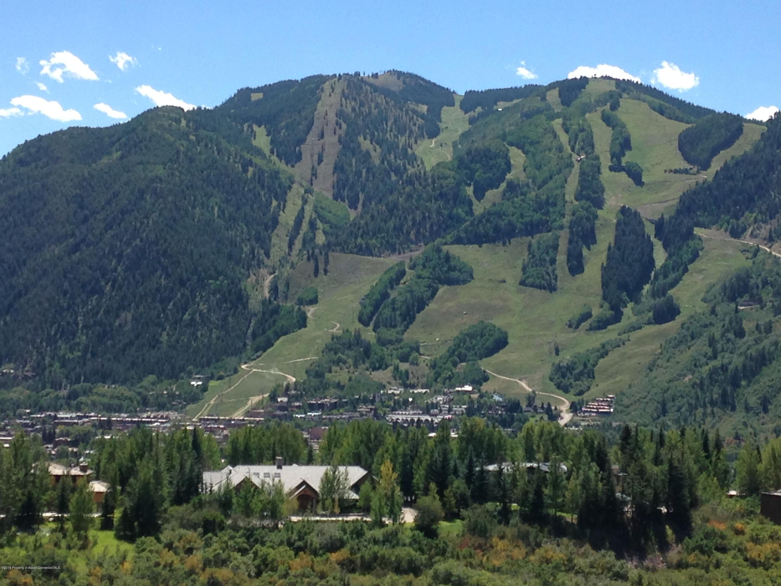 221 Wright Road Aspen, CO 81612 - Photo 2 of 16 a view of a house with a mountain in the background