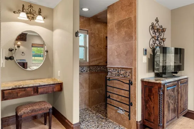 a view of hall way with furniture and mirror