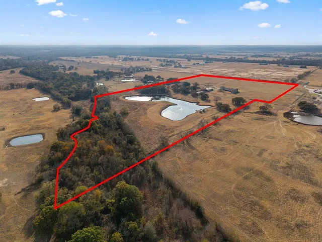 a view of a pool and an outdoor space