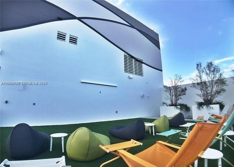 1010 Brickell Avenue, Unit 3211 Miami, FL 33131 - Photo 2 of 11 an aerial view of a house with pool patio and outdoor seating
