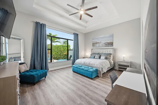 a bedroom with a large bed and a large window