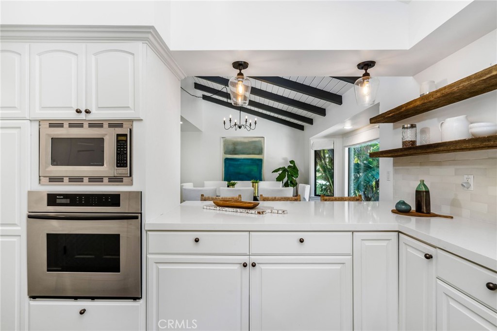 24743 Vantage Point Terrace Malibu, CA 90265 - Photo 18 of 64 a kitchen with a stove and a microwave