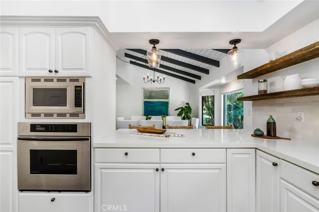a bathroom with a sink mirror and vanity