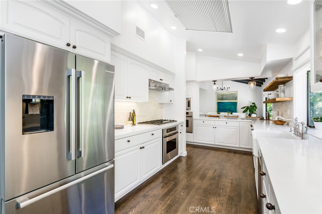 24743 Vantage Point Terrace Malibu, CA 90265 - Photo 19 of 64 a kitchen with stainless steel appliances a refrigerator sink and stove