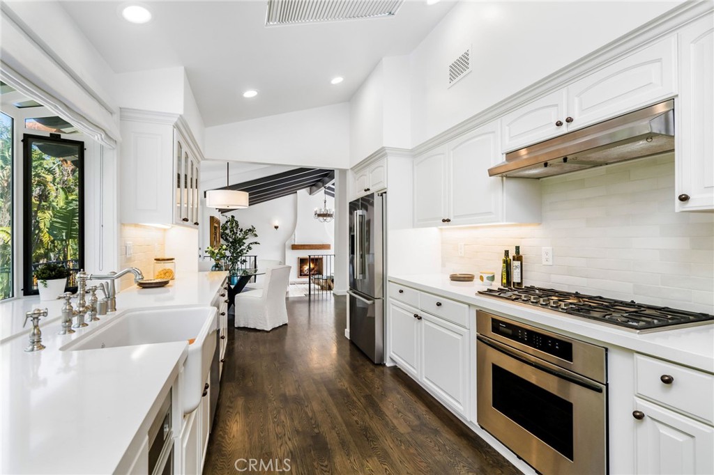 24743 Vantage Point Terrace Malibu, CA 90265 - Photo 20 of 64 a kitchen with stainless steel appliances a sink dishwasher stove and refrigerator