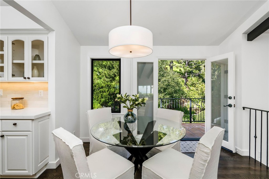 24743 Vantage Point Terrace Malibu, CA 90265 - Photo 21 of 64 a view of a dining room with furniture window and wooden floor