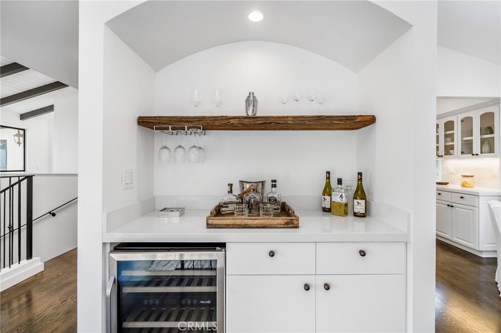 24743 Vantage Point Terrace Malibu, CA 90265 - Photo 28 of 64 a view of kitchen island with cabinets and wooden floor