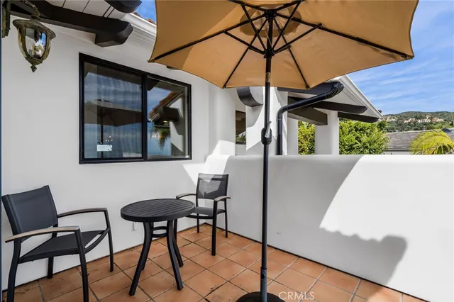 a bathroom with a granite countertop toilet a sink and a mirror