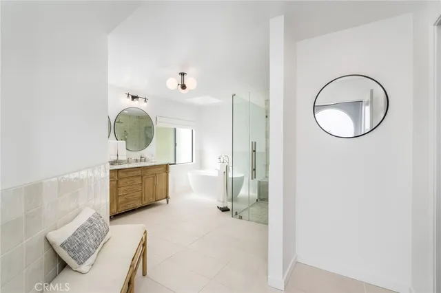 a living room with furniture potted plant and a fireplace
