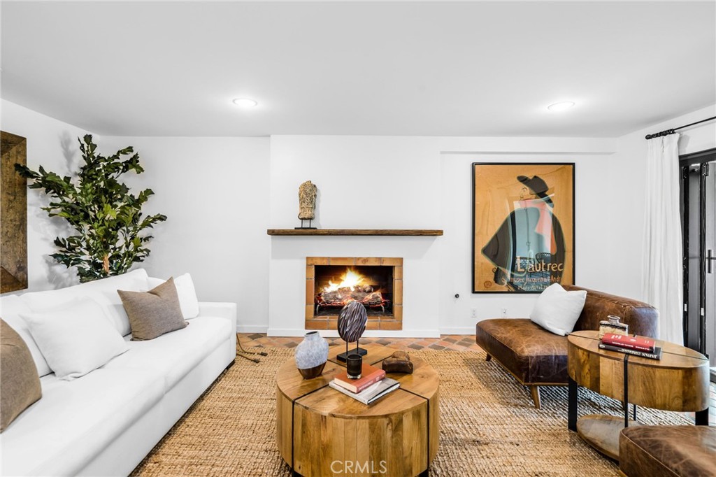 24743 Vantage Point Terrace Malibu, CA 90265 - Photo 43 of 64 a living room with furniture and a fireplace