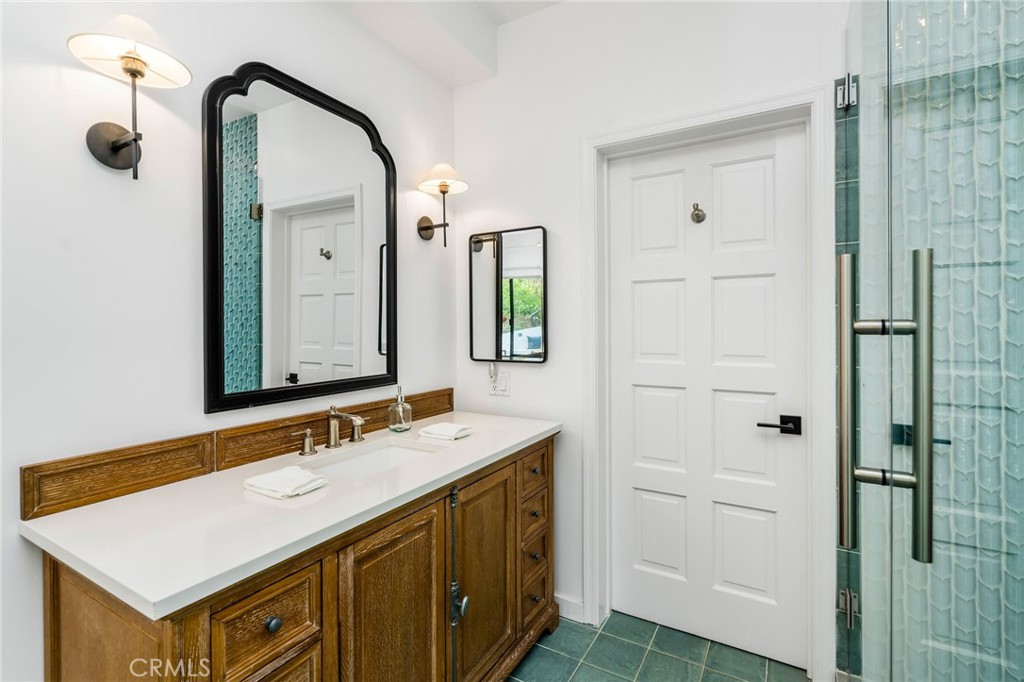 24743 Vantage Point Terrace Malibu, CA 90265 - Photo 48 of 64 a bathroom with a sink and a mirror