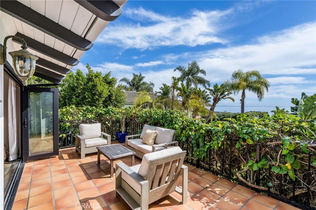 24743 Vantage Point Terrace Malibu, CA 90265 - Photo 5 of 64 a view of a patio with table and chairs and potted plants
