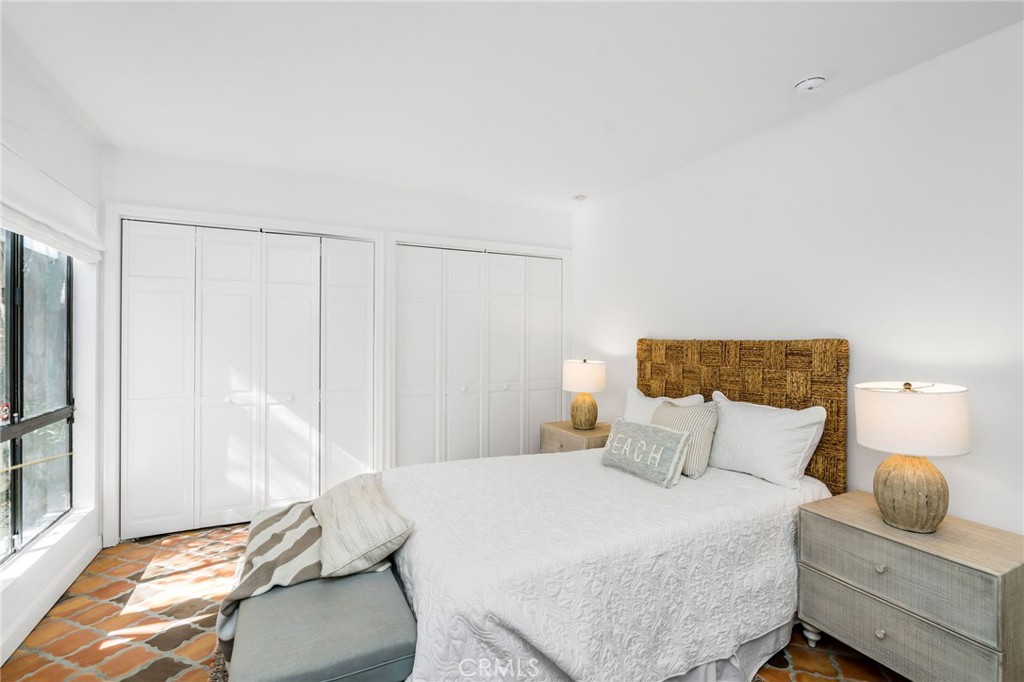 24743 Vantage Point Terrace Malibu, CA 90265 - Photo 56 of 64 a bedroom with a bed and a window