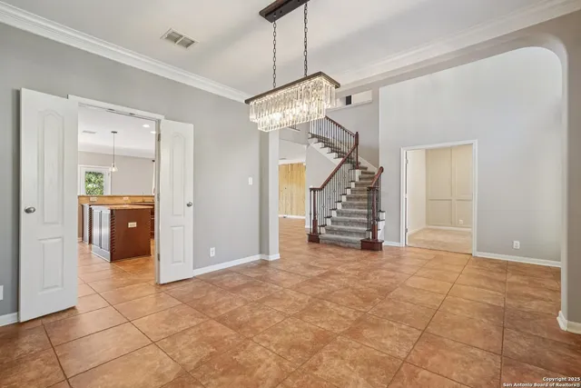 a kitchen with a stove sink and cabinets