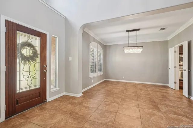 a view of an entryway with wooden floor and door