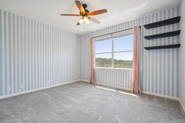 a backyard of a house with a yard and outdoor seating