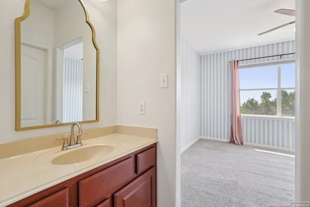 a view of a entrance gate of the house and trees