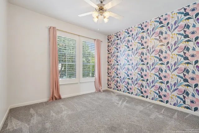 a front view of a house with a yard and a garden